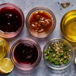 Variety of marinade ingredients including oils, vinegar, and spices.